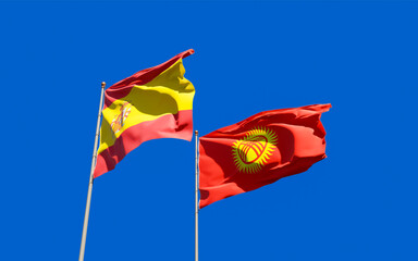 Flags of Kyrgyzstan and Spain.