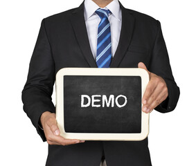 A Businessman holding slate mini blackboard with message Demo