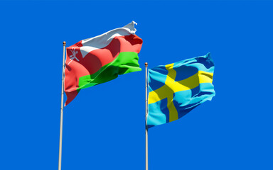 Flags of Oman and Sweden.