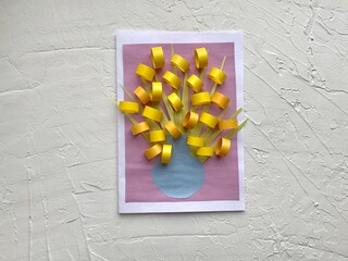 Children's applique, spring flowers made of colored paper.