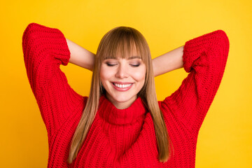 Photo of blond optimistic lady hands head sleep wear red sweater isolated on bright yellow color background