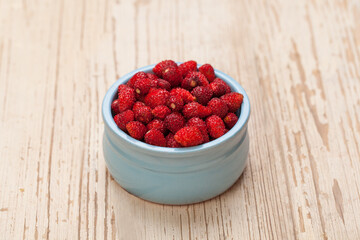 Organic strawberries on white vintage wooden background, organic food concept