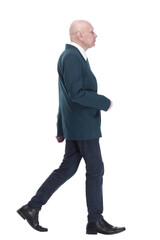 Mature business man striding forward. isolated on a white background.