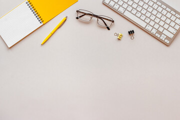 Office workplace flat lay with keyboard wand notebook