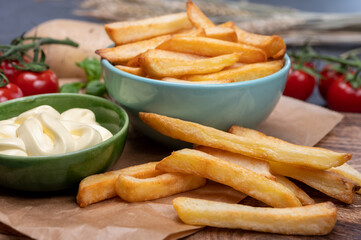 Bown with fresh cooked french fries potato chips with belgian mayonnaise sauce