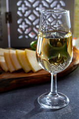 Tasting of fortified Andalusian sherry wine with traditional Spanisch tapas, green olives, goat and sheep manchego cheese
