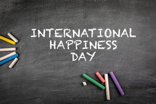 International Day of Happiness 20 March. Gray chalk board background