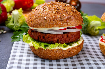 Tasty hamburger made with vegetarian plant based imitation minced meat burger and fresh vegetables