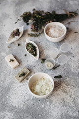 herbal cosmetics, cream and powder, natural ingredients. samples of cosmetics on a gray background