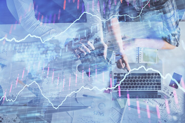 Double exposure of man and woman working together and financial graph hologram drawing. market analysis concept. Computer background. Top View.