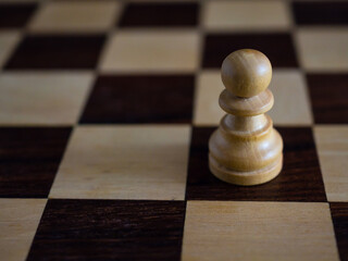 Wooden chess pawns close up with copy space