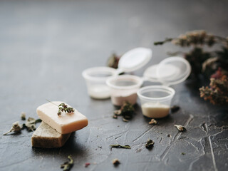 Spa cosmetics: scrub, salt, herbal soap, natural ingredients.