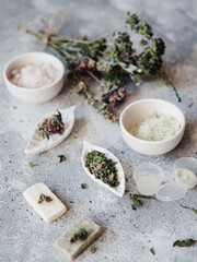 herbal cosmetics, cream and powder, natural ingredients. samples of cosmetics on a gray background