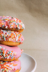 vegan pink donuts over beige background