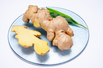 Fresh ginger rhizome root used in traditional medicines and for flavoring meals isolated on white