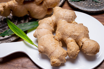 Fresh ginger rhizome root used in traditional medicines and for flavoring meals worldwide.