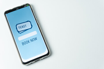 Fototapeta premium Phone with booking app on white background