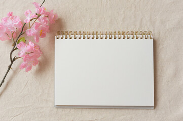 Cherry blossoms and a notebook on the cloth.  布の上の桜とノート