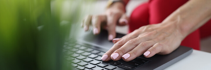 There is laptop on table. Female hands are typing text. Tester training from scratch concept