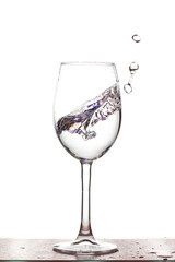 A splash of water in a glass on a white background.