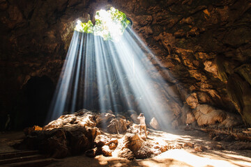 Sun Beams Shine Down Through Cave
