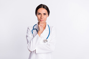 Photo of serious brainstorming young woman doctor wear formal coat arm chin isolated white color background