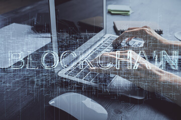 Double exposure of woman hands typing on computer and crypto market theme hologram drawing. Blockchain concept.