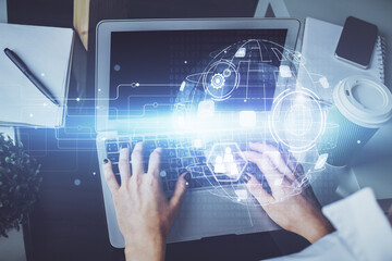 Double exposure of woman hands typing on computer and social network theme hologram drawing. People media concept.