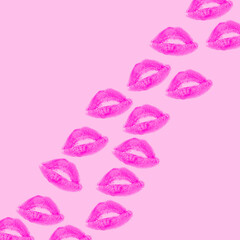 Creative pattern made with purple or violet kisses on pastel pink background. Retro style...