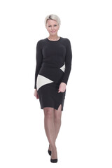 Fototapeta premium young woman in an elegant dress striding forward. isolated on a white background.