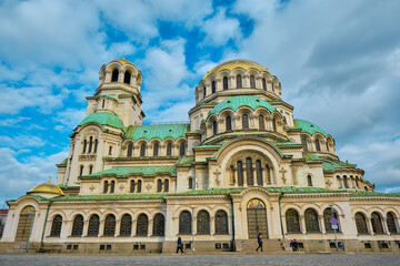 Fototapeta na wymiar Gorgeous architecture of Alexander Nevsky Orthodox cathedral with blue sky background. Bulgaria. Sofia. 06.01.2021.