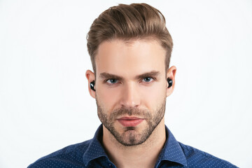 handsome unshaven man with wireless bluetooth earphones isolated on white, bluetooth headset