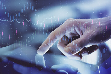 Multi exposure of man's hands holding and using a digital phone and forex graph drawing. Financial market concept.
