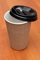 cardboard cup on a wooden background