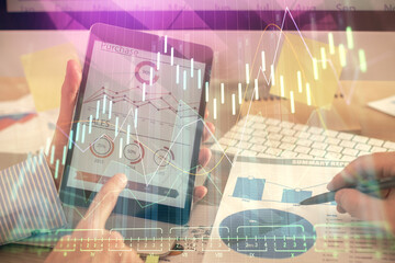 Multi exposure of man's hands holding and using a phone and financial chart drawing. Market analysis concept.