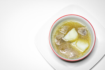 Pork rib soup and potato in white bowl on white background.
