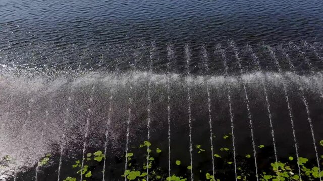 Fountain from a bird's eye view. Cyclic aeration of water in the lake to prevent its flowering.