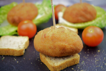 Macro, croquette, tapas, typical of Spain.
