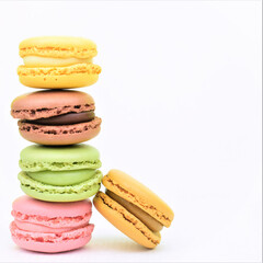Colorful macarons, sweets, on white background, typical french.