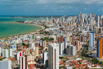 Fototapeta na wymiar Joao Pessoa, Paraiba State, Brazil on May 4, 2019. Partial view of the city showing buildings, Manaira beach and the tip of Cabo Branco.