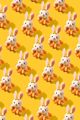 Pattern with rabbit toy. Creative background for celebration of Easter.