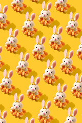 Fototapeta premium Pattern with rabbit toy. Creative background for celebration of Easter.