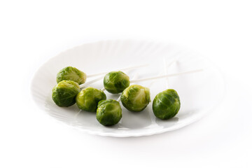 Set of brussel sprouts with lollipop sticks isolated on white background