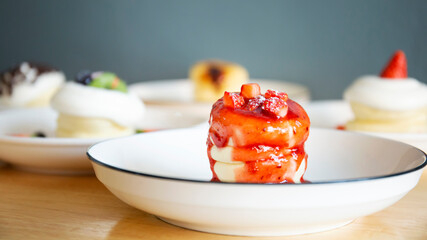 Japanese-style pancakes on a wooden table are ready to serve.