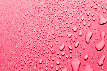 Water drops on red background, macro