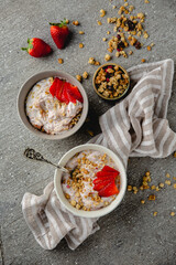 Creamy ricotta, yoghurt with strawberries and granola. Healthy breakfast. Farm dairy products. Eco-friendly healthy high-protein food.
