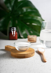 selective focus. Collagen powder in a glass container. light background. copyspace. Extra protein intake. Natural beauty and Health supplement for skin, bones, joints and intestines