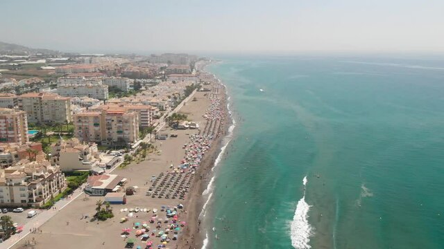 Torrox Beach Full of Tourists, Aerial View of Turquoise Water and Resorts