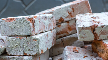 Brick Stone shabby rocks and separated by large cracks and layers. Rough, rough gray stone or rocky mountain texture