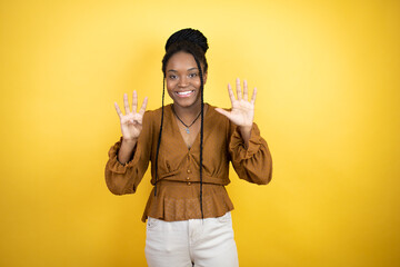 African american woman wearing casual clothes showing and pointing up with fingers number nine...